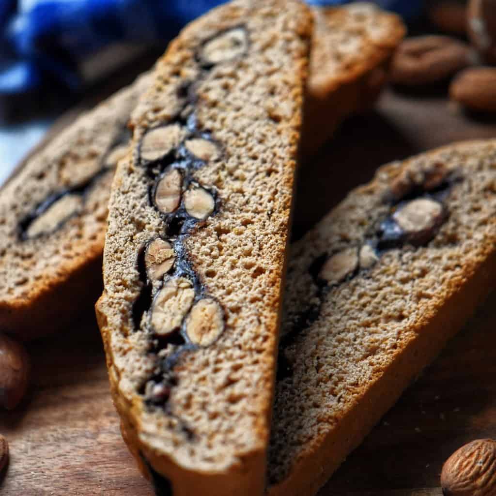 A sliced biscotti cookie with an almond and chocolate filling.