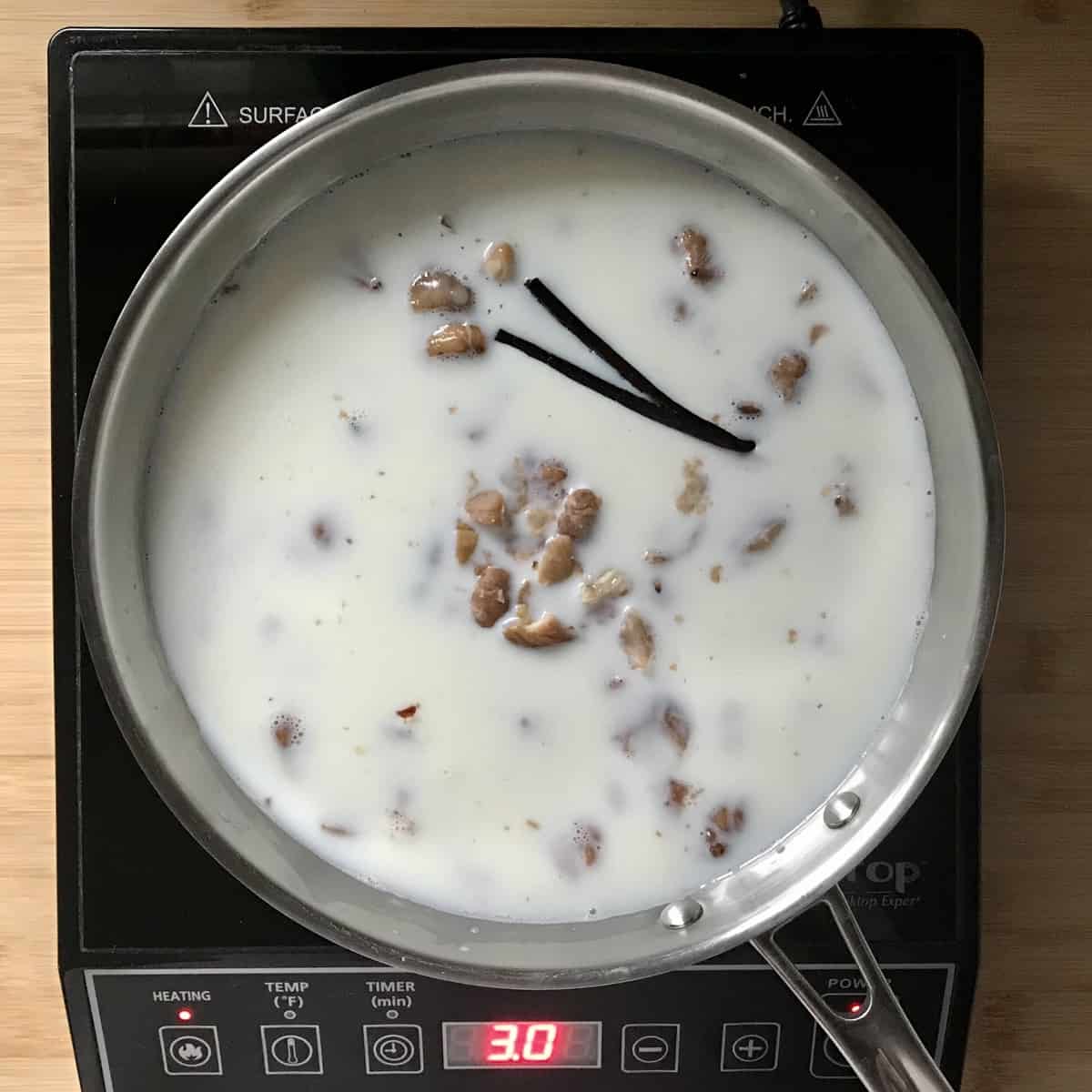 Chestnuts in a saucepan, simmering in milk. 