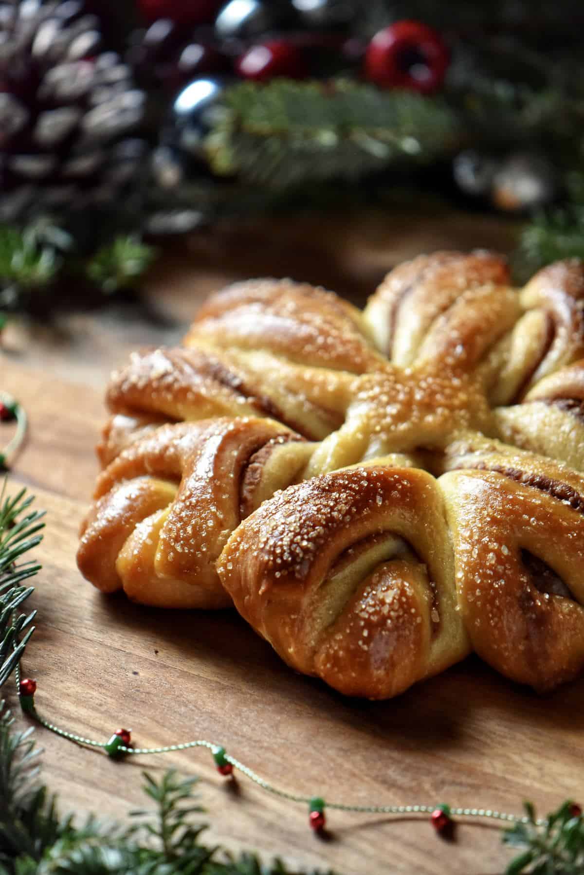 A festive yeast bread on a wooden board.