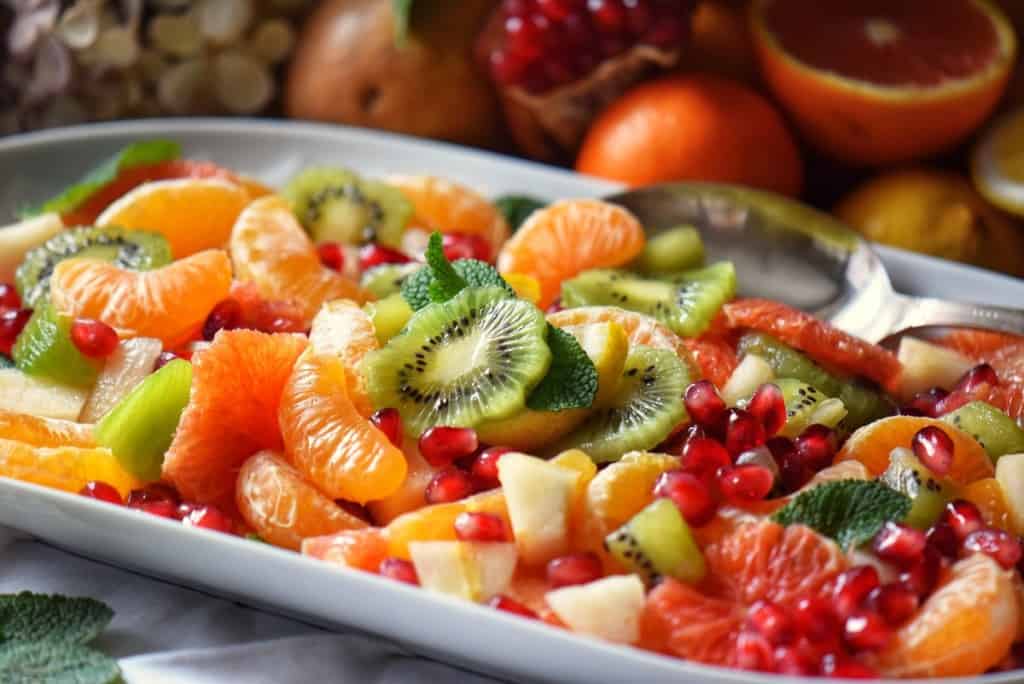 Colorful winter fruits on a platter.