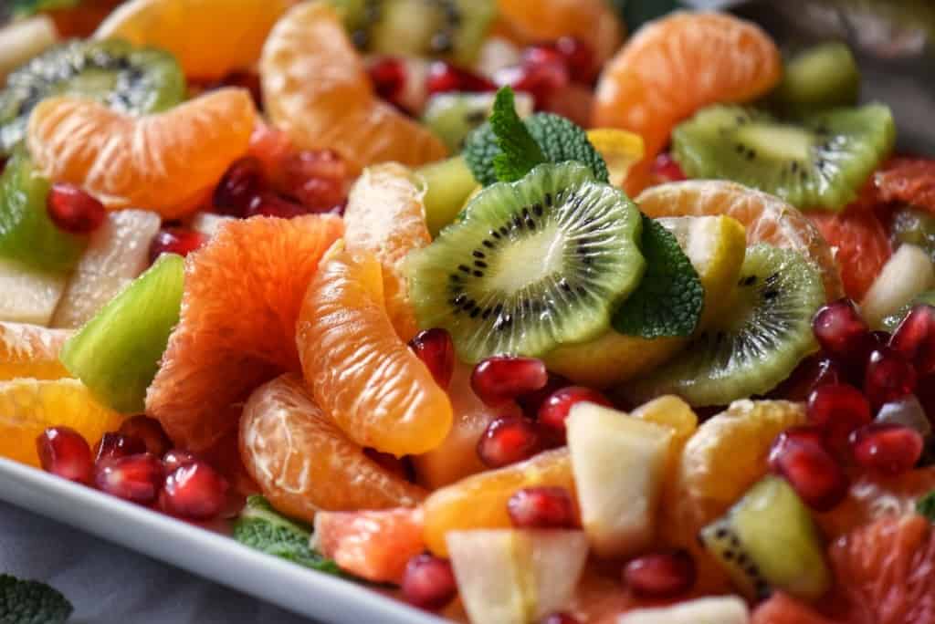 A close up photo of the sliced and diced fruit used in a winter fruit salad.