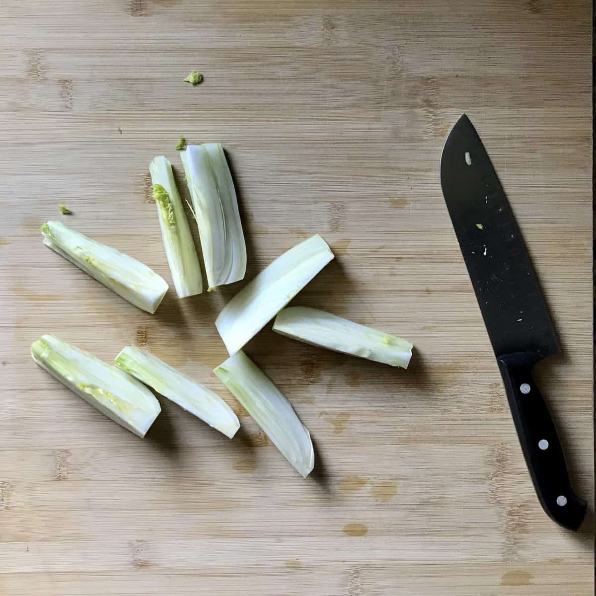 Sliced fennel on a wooden board. 