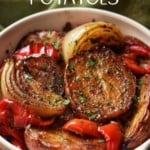 Roasted Red Potatoes, caramelized onions and roasted bell red peppers in a white dish.