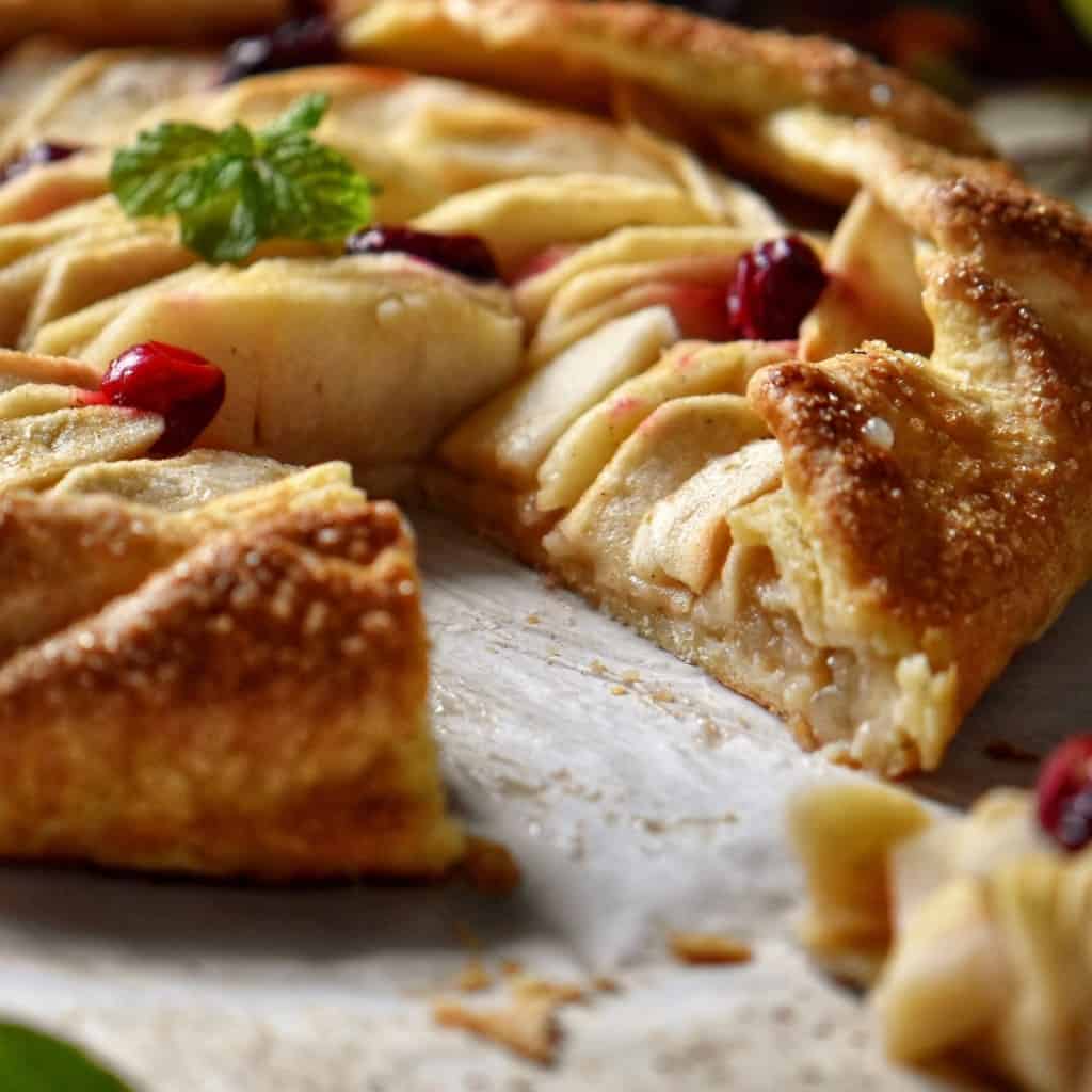 A slice of apple crostata missing from this easy Italian dessert.