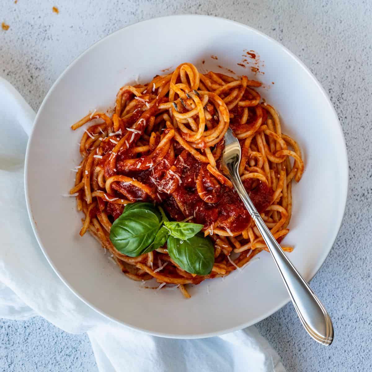 Spaghetti in a white plate.