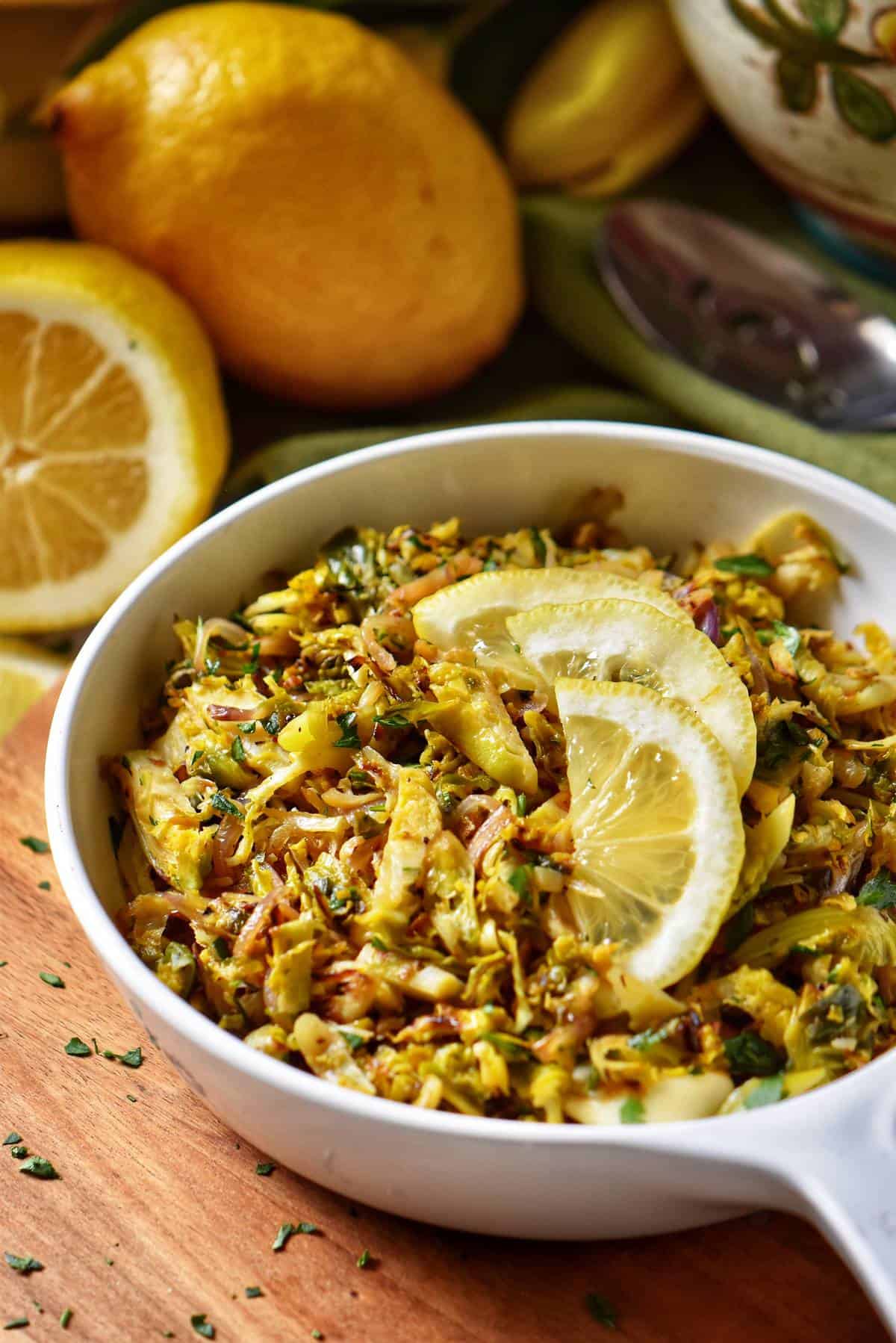 Shaved Brussels Sprouts in a white dish.