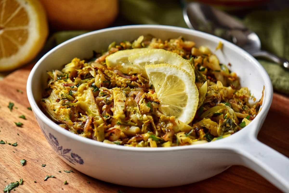 A serving platter of shaved Brussels sprouts.