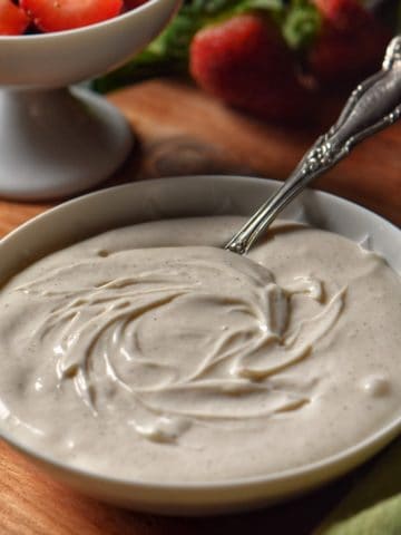 Sweet whipped ricotta in a white bowl.