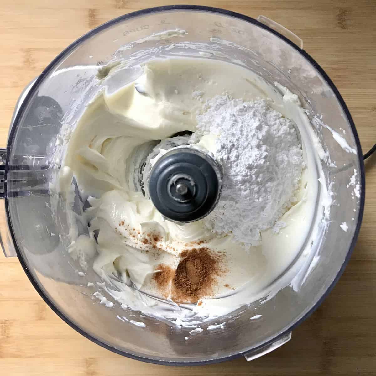 Cinnamon and icing sugar added to whipped ricotta. 