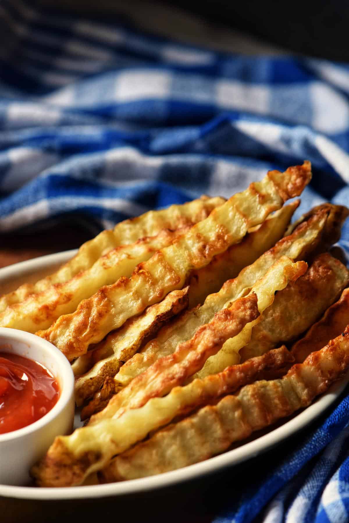 A small plate of crinkle-cut fries.