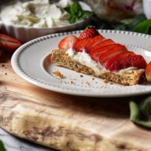 Ricotta toast on a white plate.