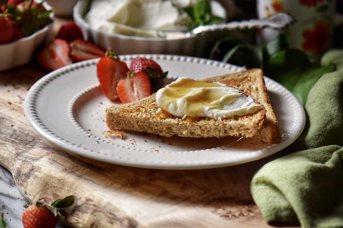 Honey and ricotta on a piece of whole grain toast.