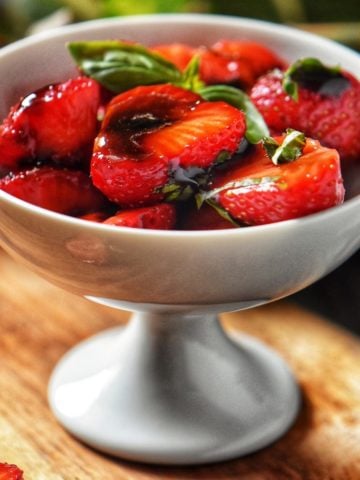 Balsamic Glazed Strawberries in a white bowl.