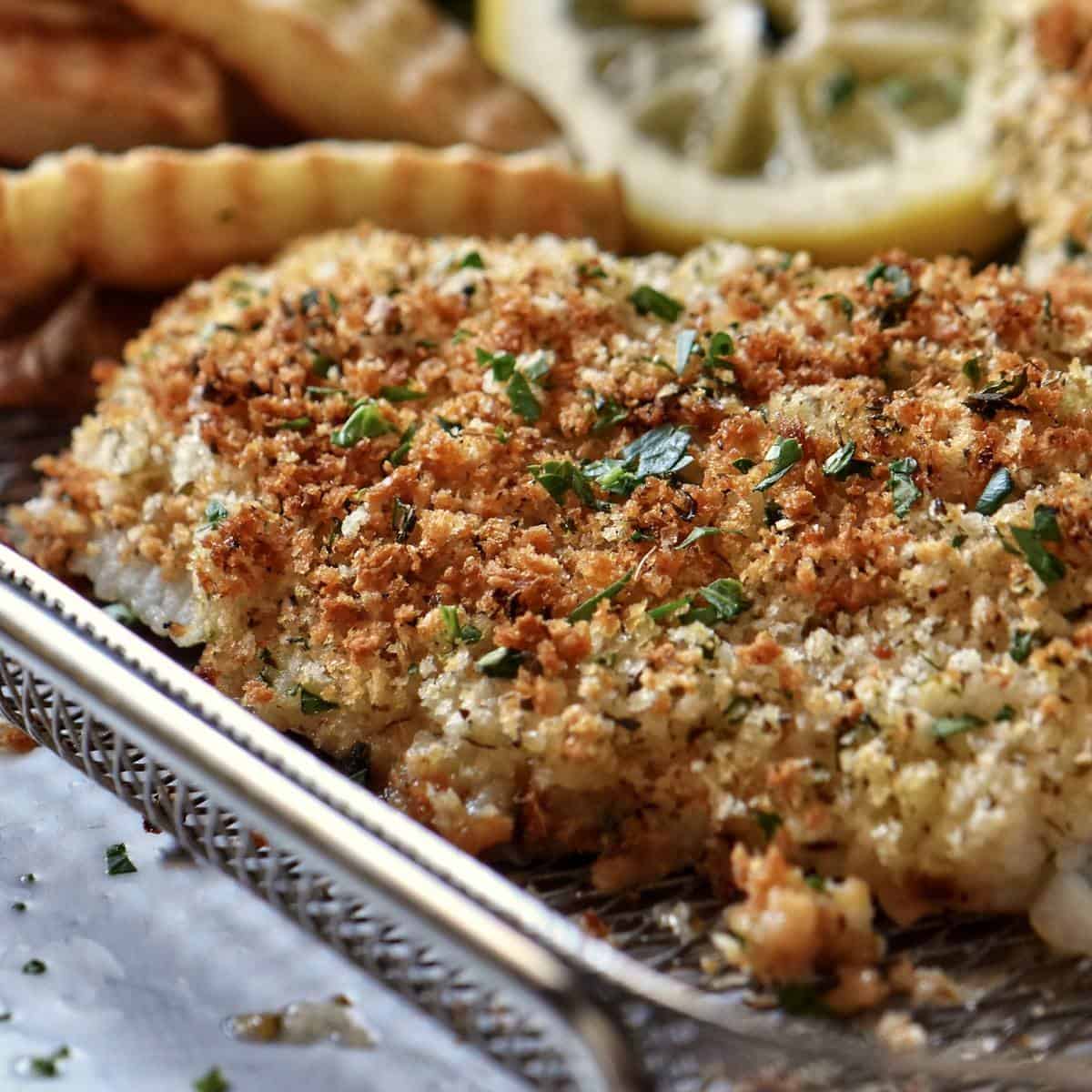 Air fryer cod on a basket.