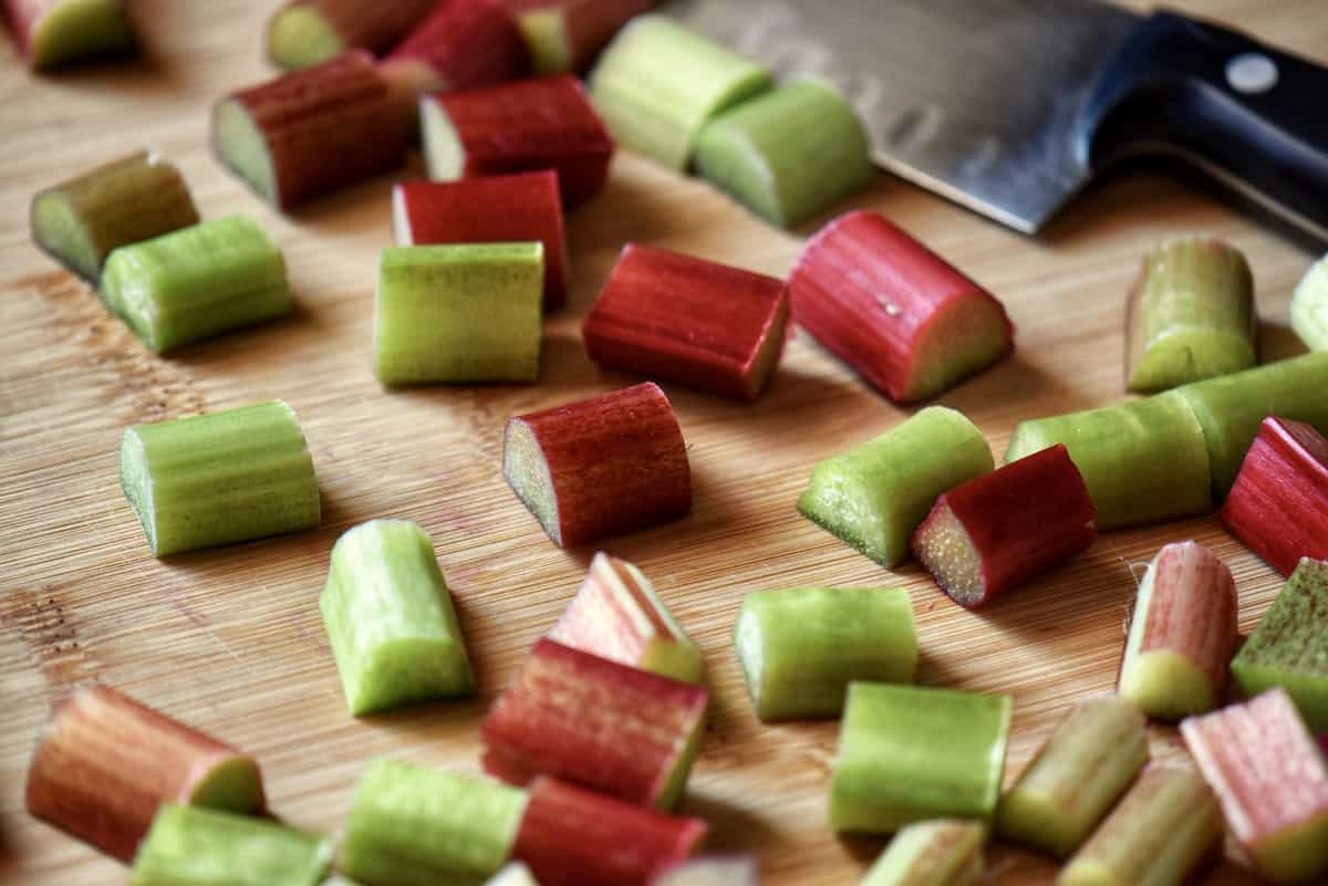 Diced rhubarb on a wooden board.