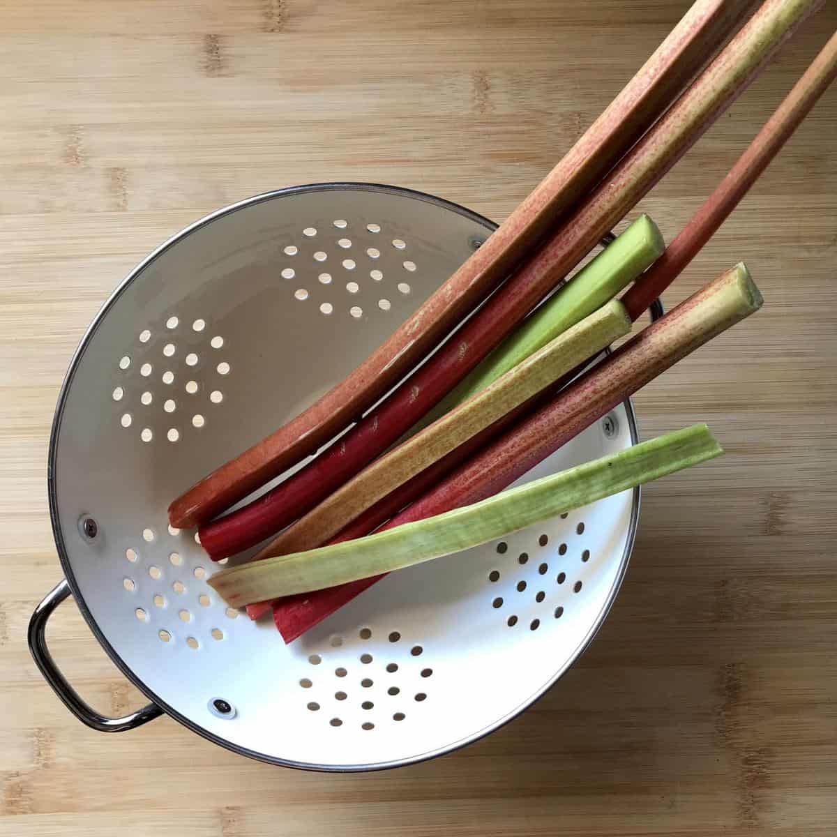 Rhubarb stalks in a colander.