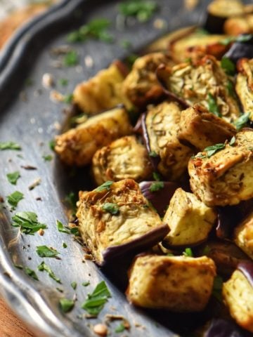 Air fryer eggplant on a silver platter.