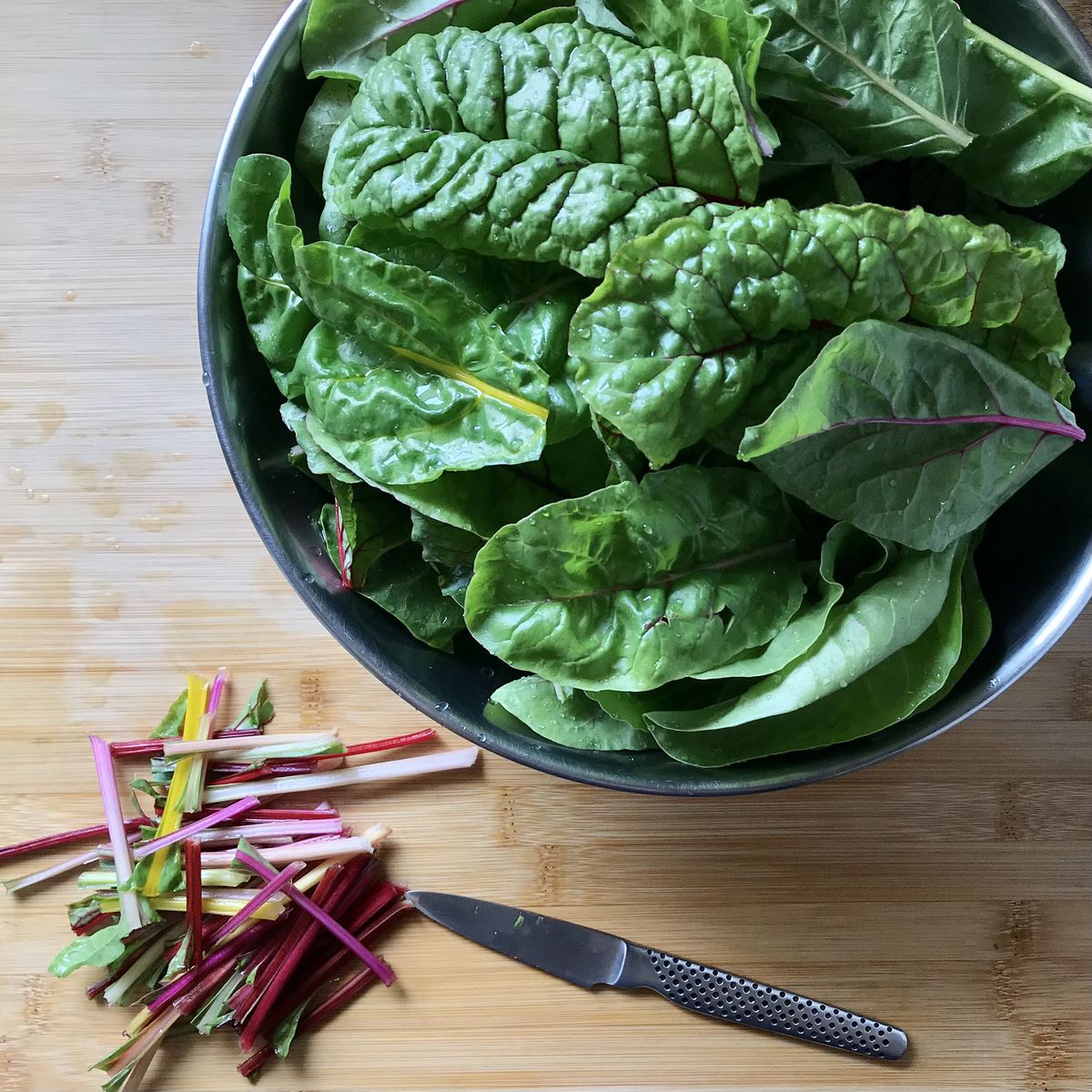 The stalks and chard leaves are separated prior to blanching.