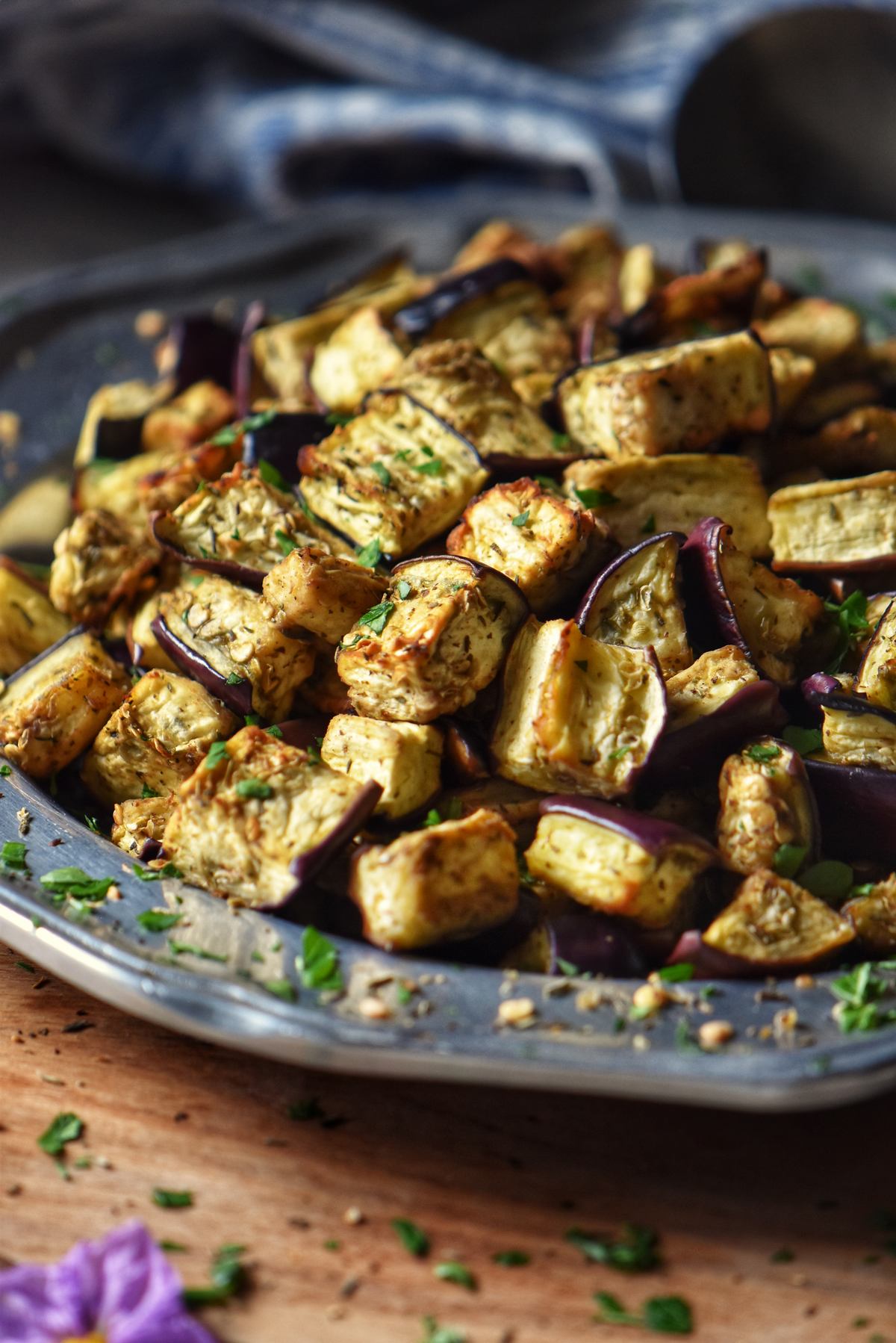 Golden air fryer eggplant on a silver platter.