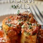 Zucchini lasagna rolls on a white plate.