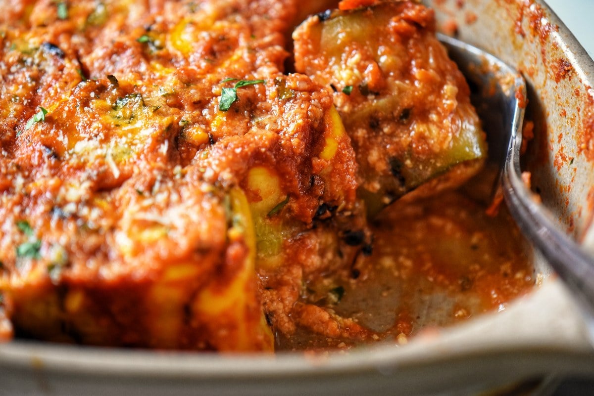 The bottom of a casserole dish demonstrating no watery zucchini roll ups. 