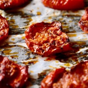 Roasted tomatoes on parchment paper.