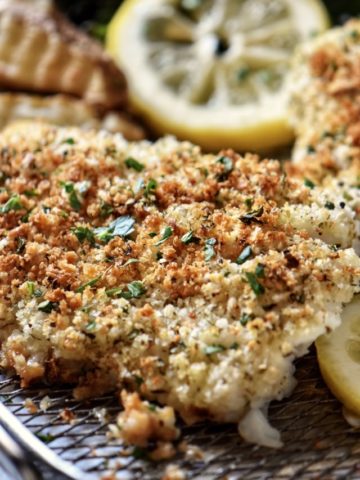 A close up of panko encrusted cod fish.