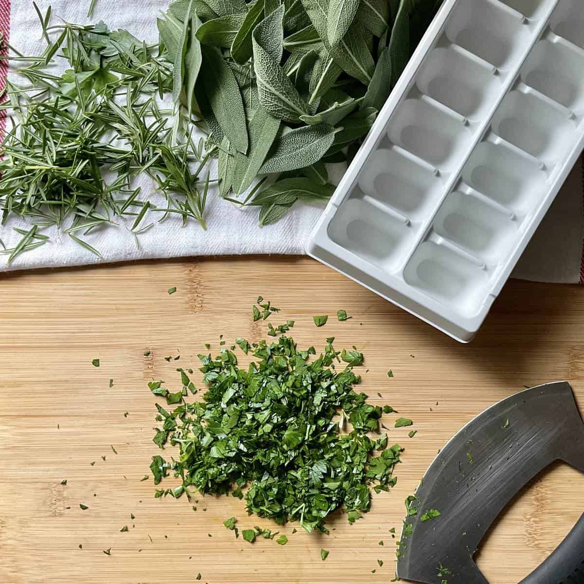 Minced parsley on a wooden board.