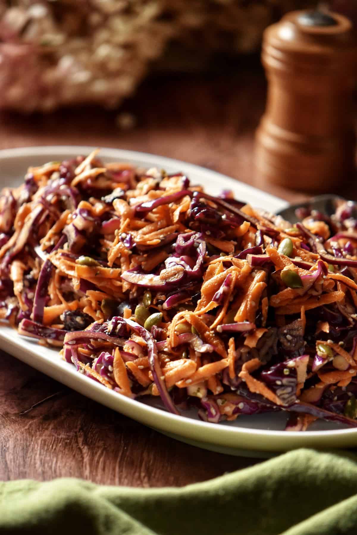 Red cabbage slaw on a large serving platter.