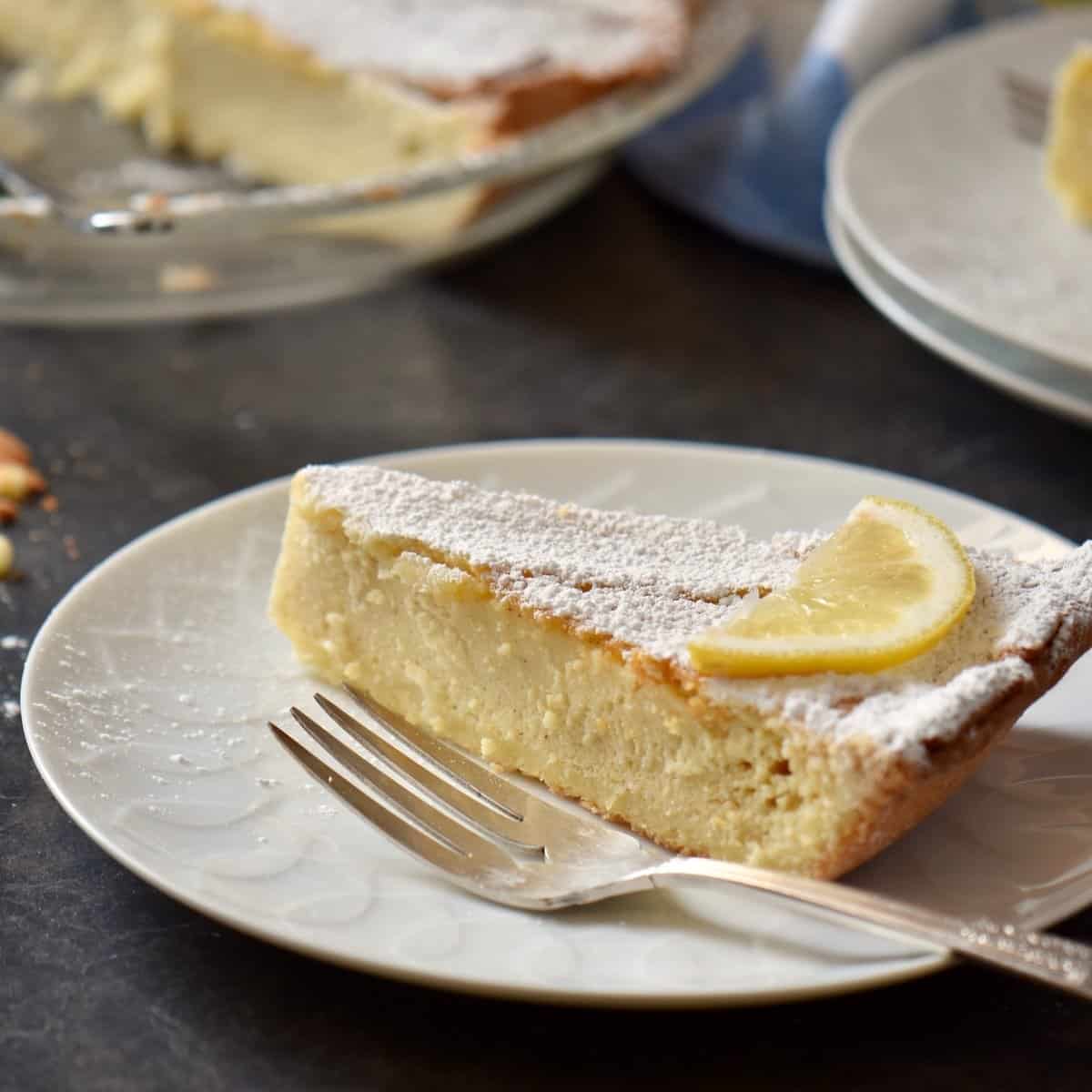 Ricotta pie on a white serving dish.