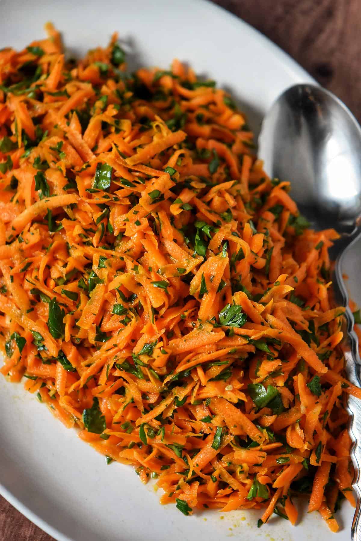 An overhead photo of carrot and parsley salad.