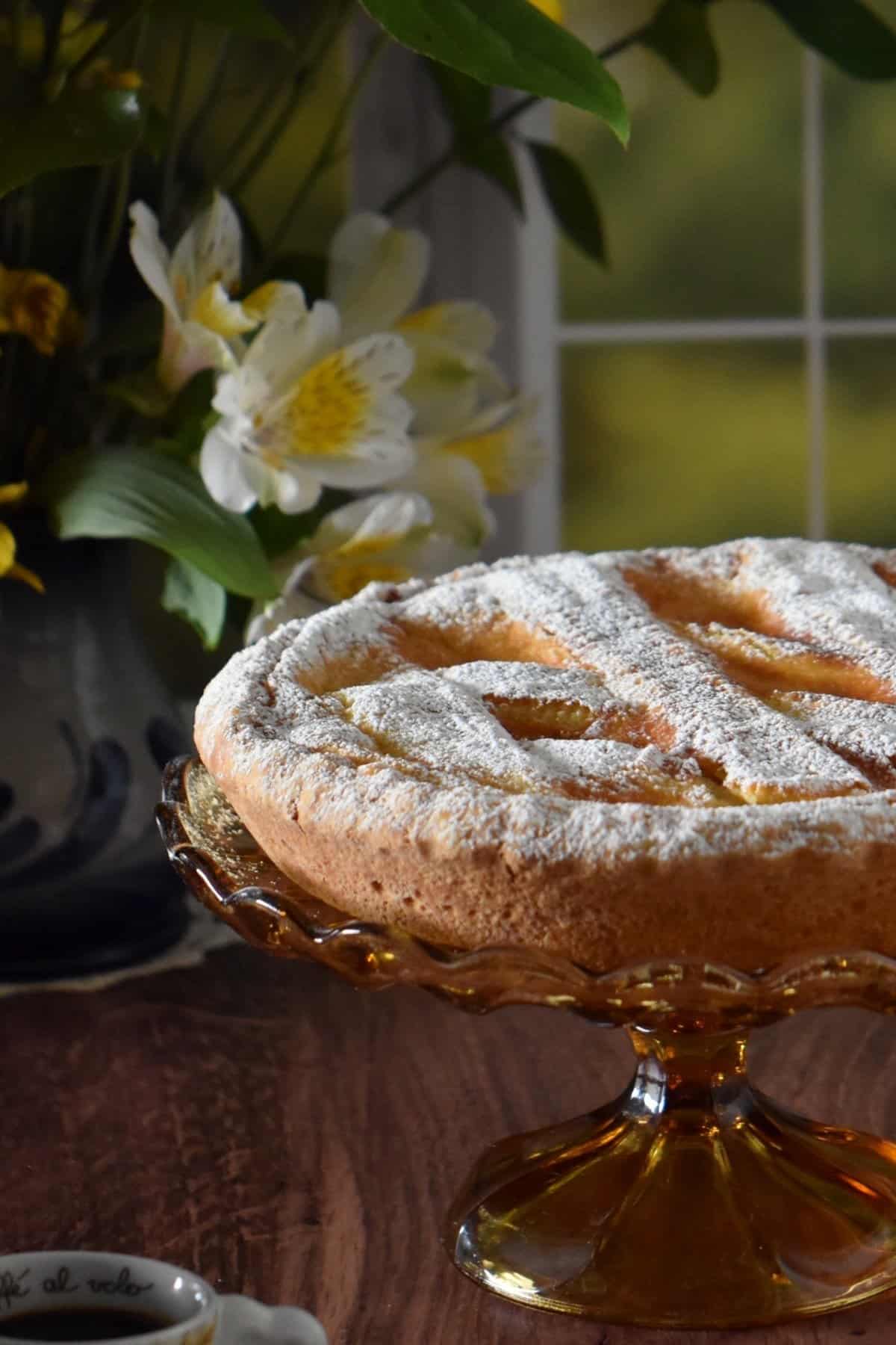 Italian Easter grain pie on an amber cake stand.