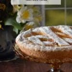 Italian Easter Grain Pie on a cake stand.