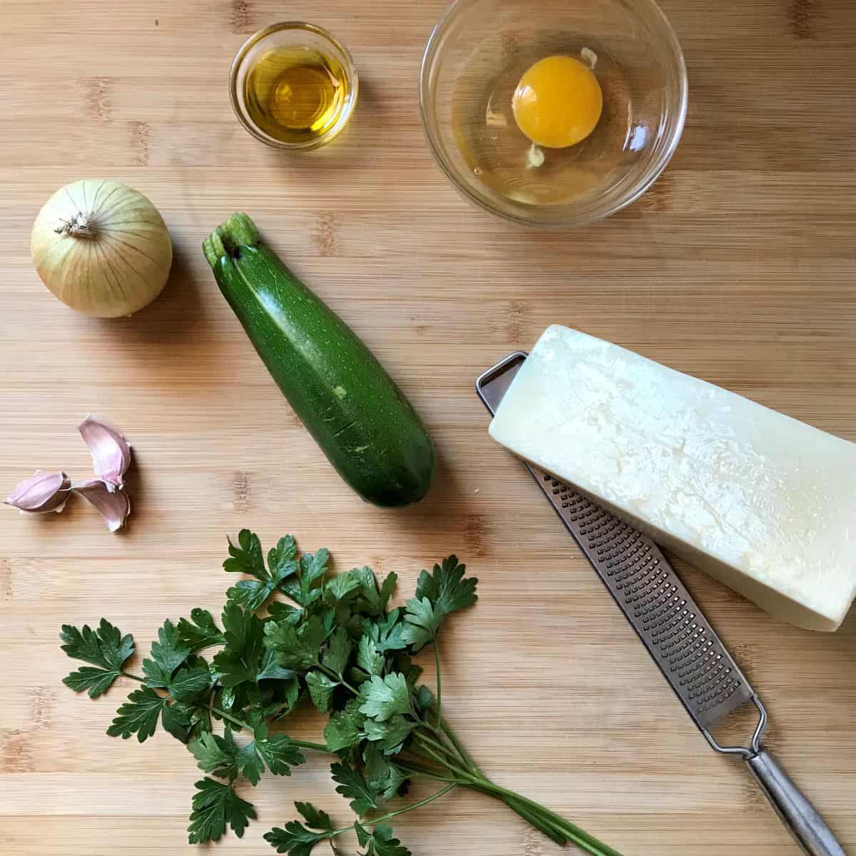 Ingredients for zucchini and eggs on a wooden board