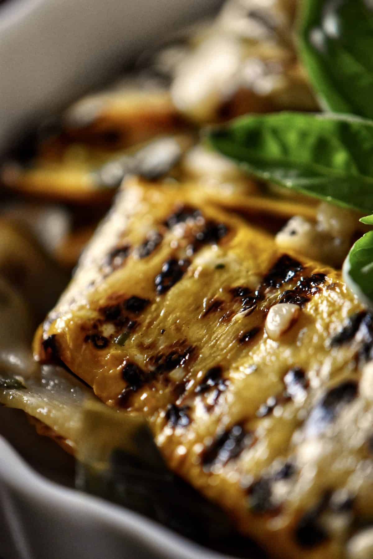 A close up of the char marks on grilled zucchini.