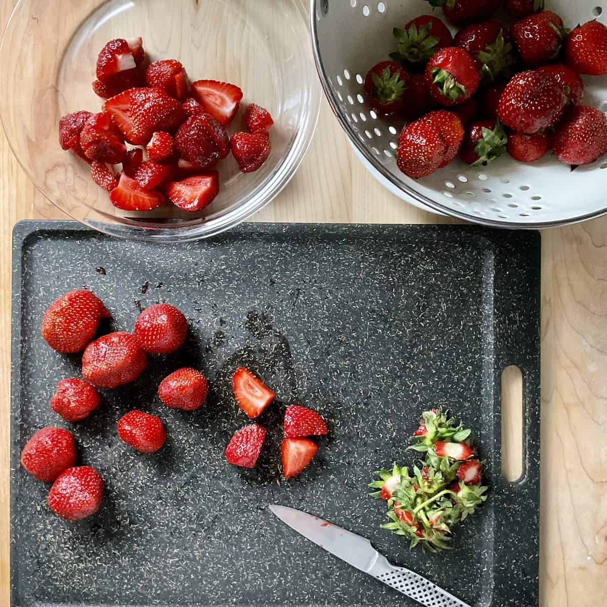 Strawberries on a cutting board.