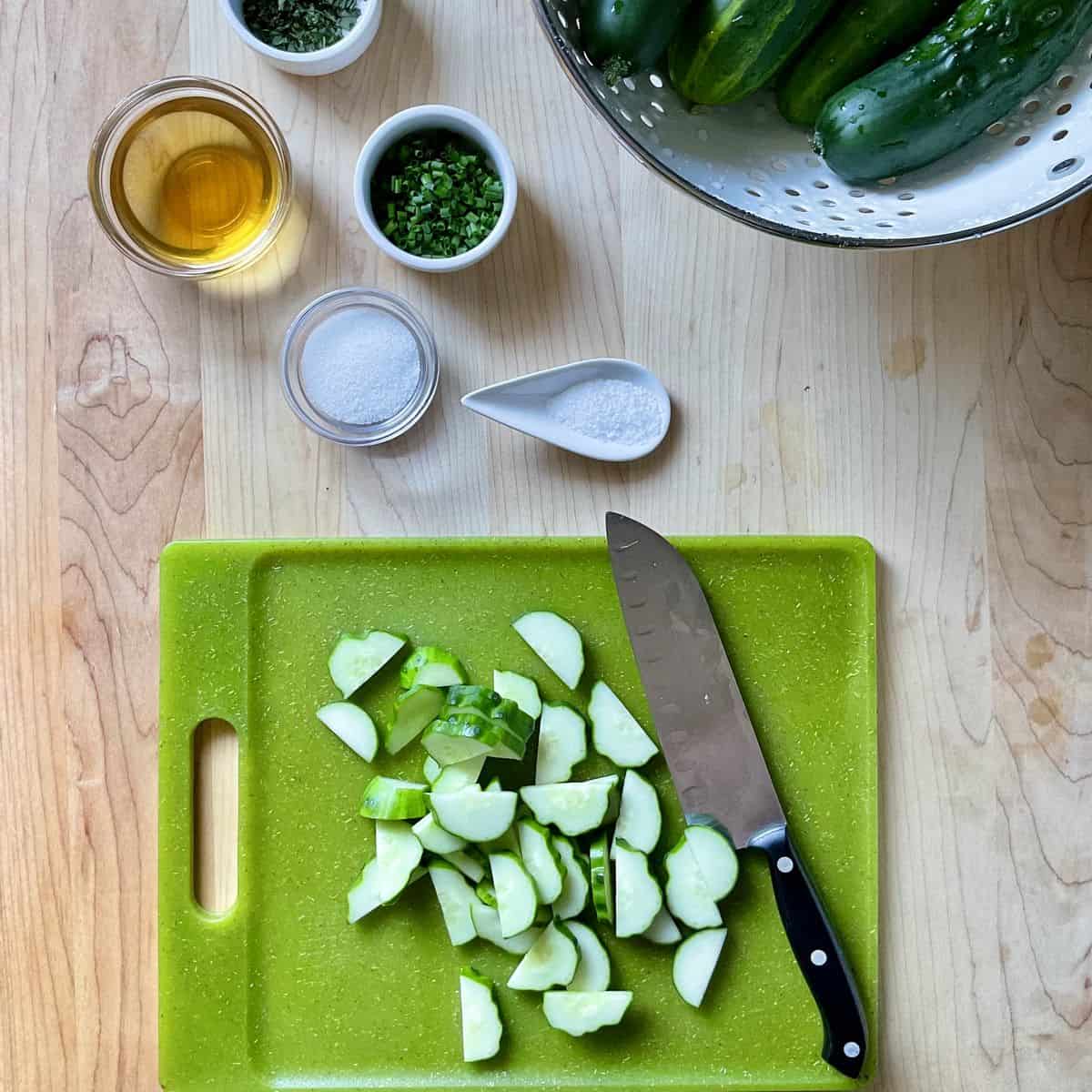 Sliced cucumbers on a cutting board.