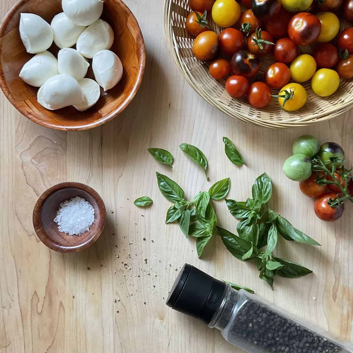 Ingredients needed to make a caprese salad.