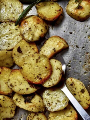 Italian roasted potatoes on a pan sheet.