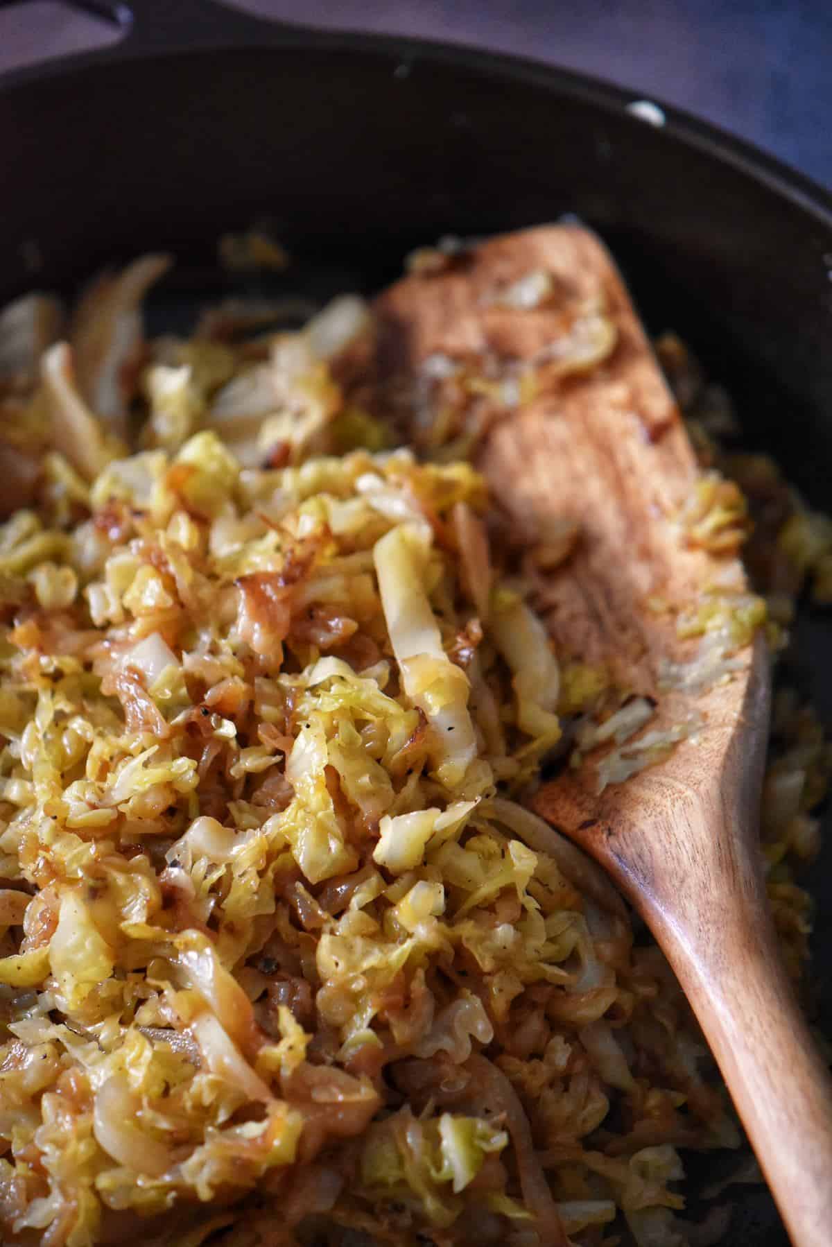 Sauteed cabbage and onions in a cast iron pan.