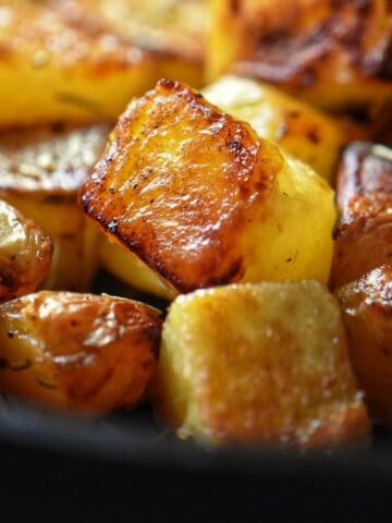 A pile of crispy cast iron cubed potatoes.