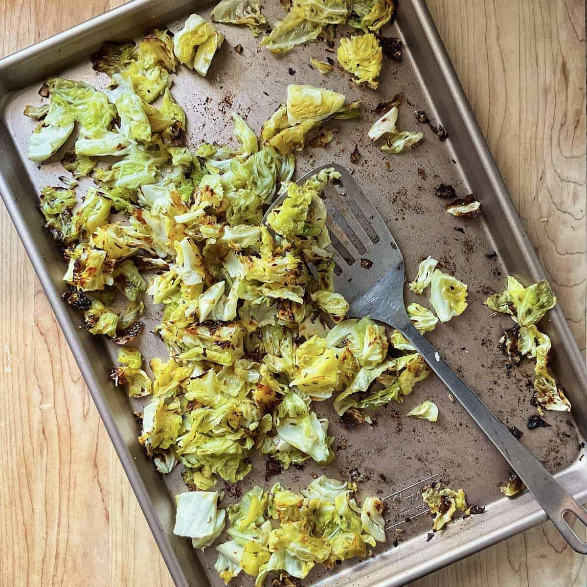 Crispy and caramelized cabbage on a sheet pan.