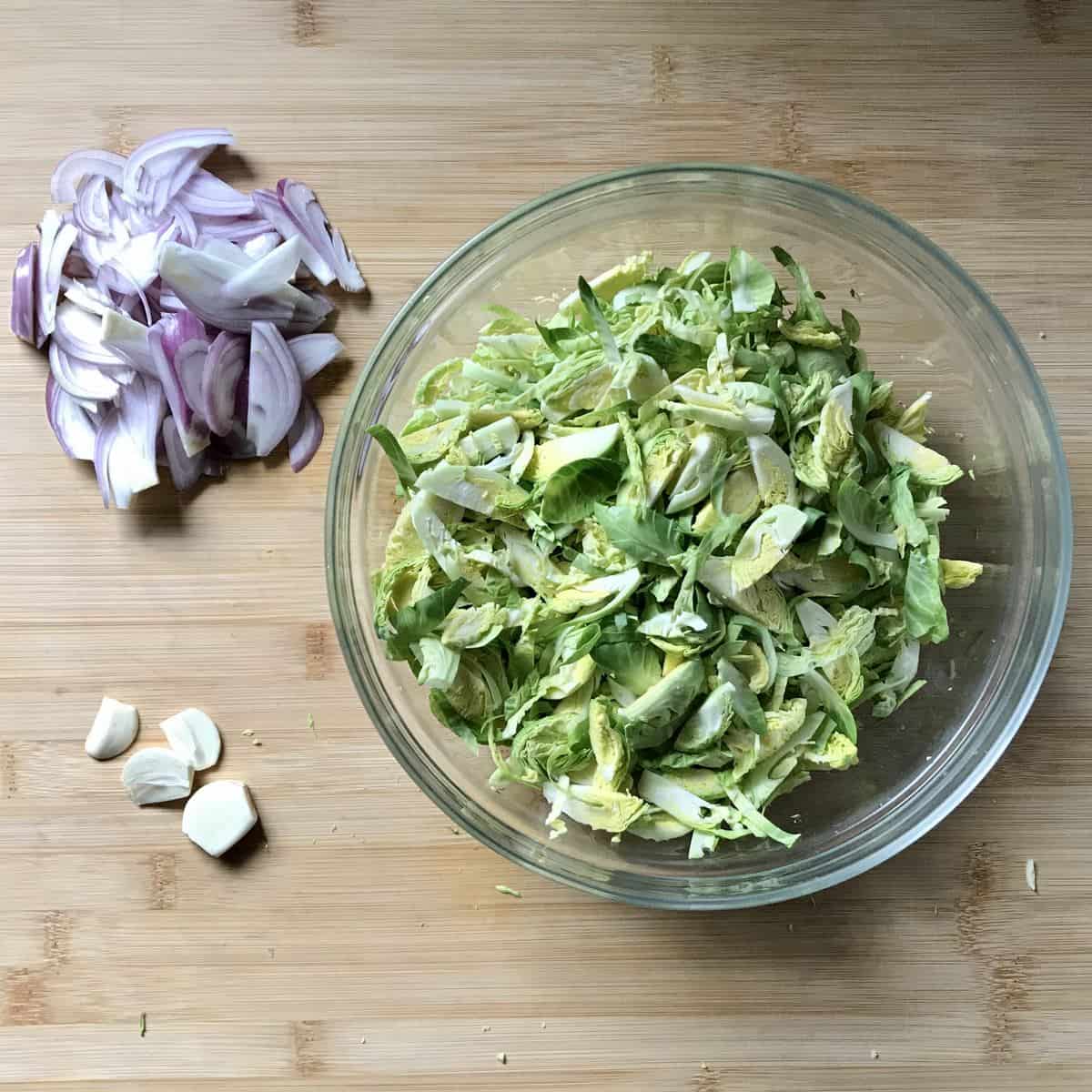 Sliced vegetables on a cutting board.