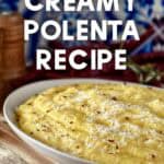 Creamy whipped polenta in a white dish, topped with red chili flakes.
