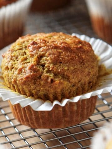 Freshly baked healthy orange muffins with dates and whole wheat flour.