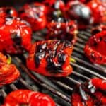 A close-up of the charred skin of a roasted red pepper