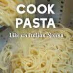 Spaghetti being drained in a colander.