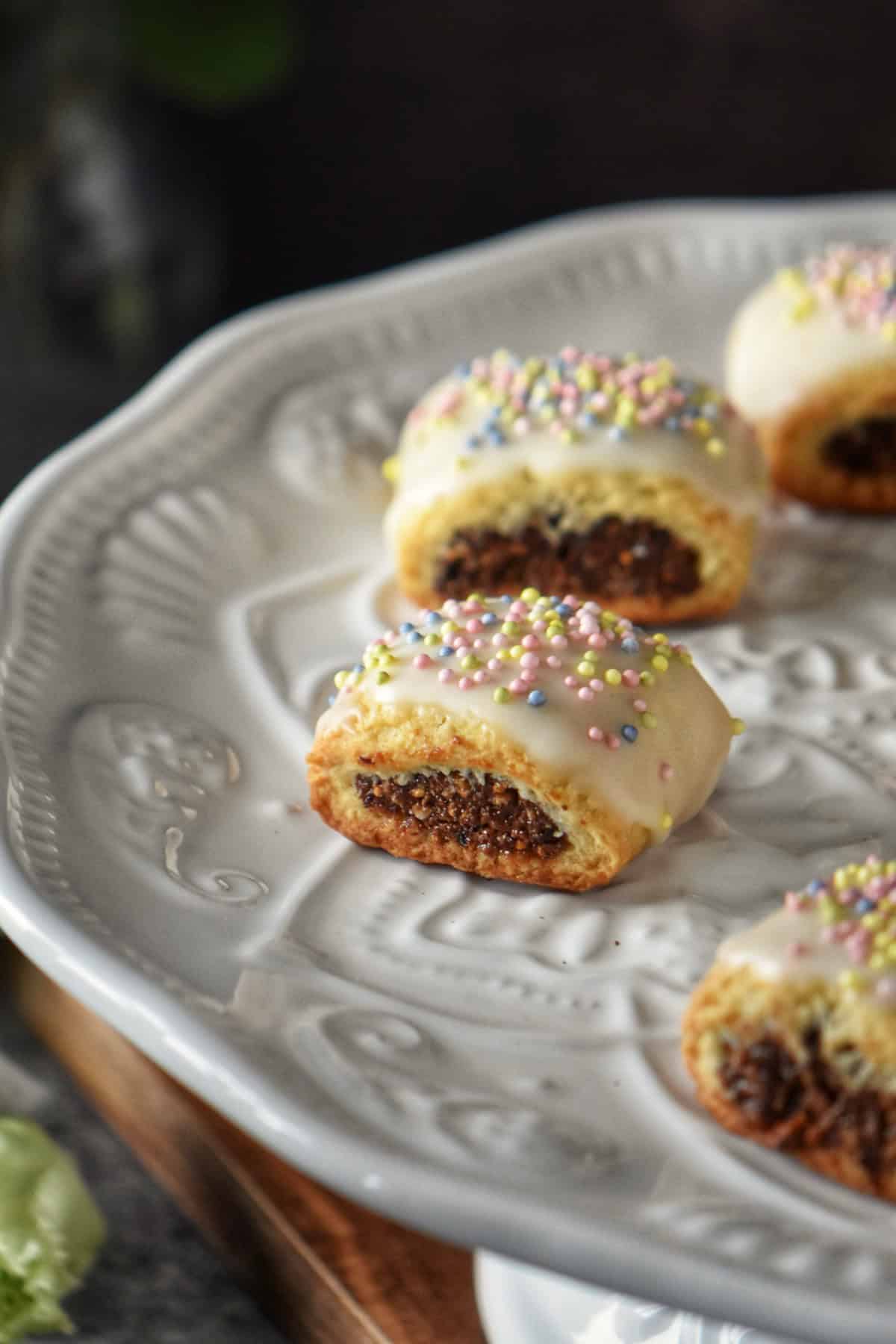 Italian fig cookies on a white platter.