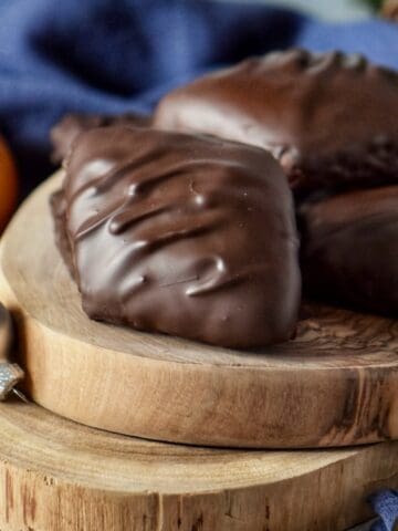Mostaccioli cookies on a wooden board.