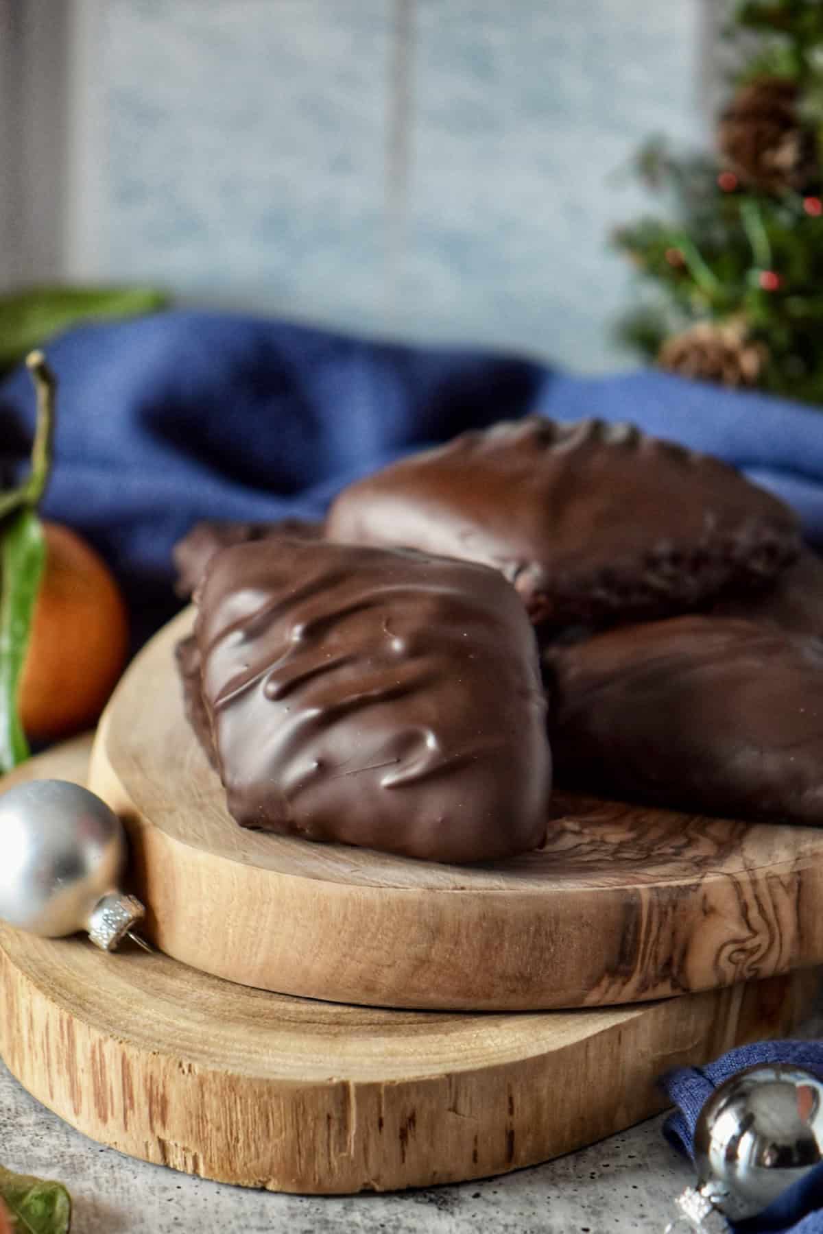 Mostaccioli cookies on a wooden surface.